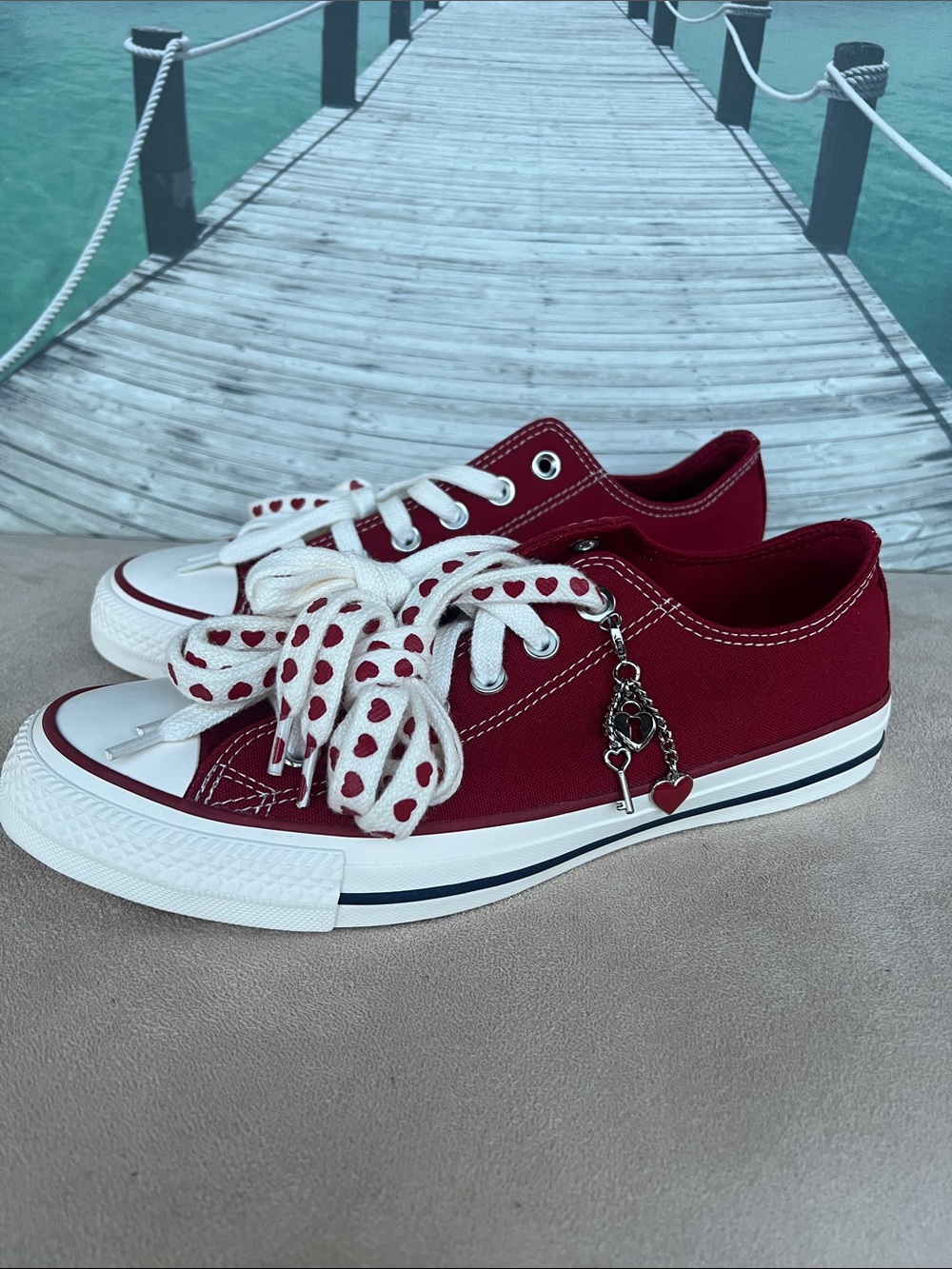Converse Women's Low Top Sneakers in Burgundy with Heart-Print Laces